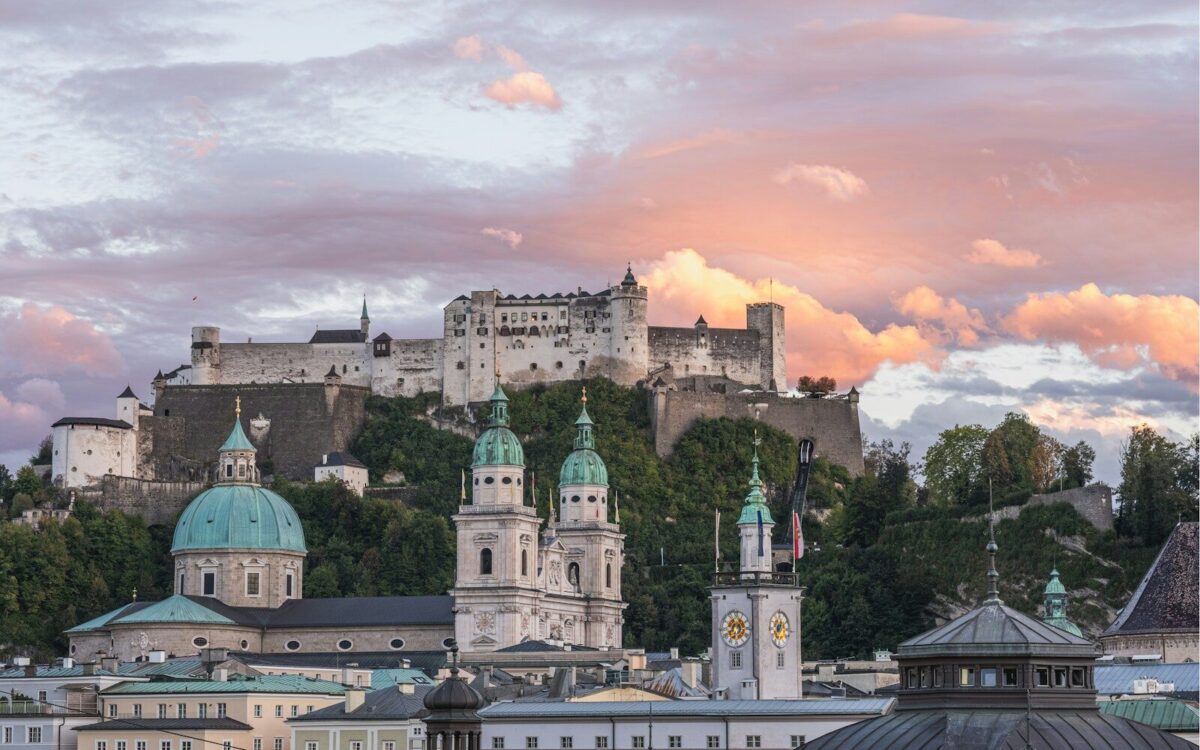 Photo by Free Walking Tour Salzburg a large building with a clock tower