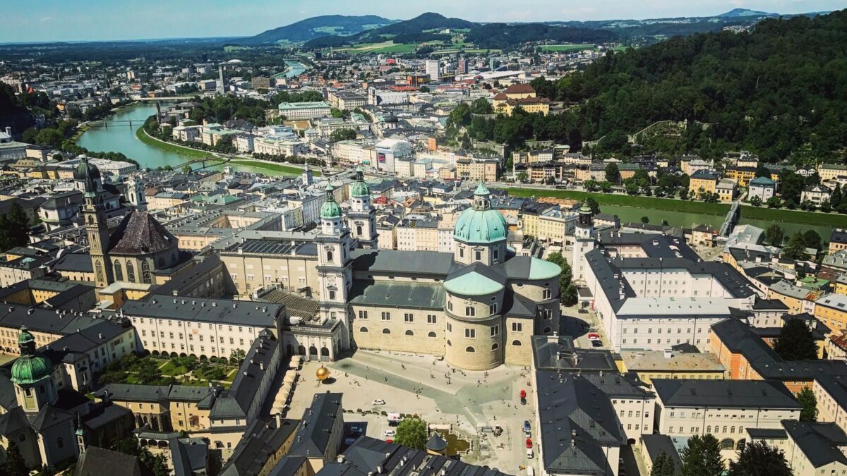 A stunning aerial view of Salzburg, Austria, showcasing its historic architecture and natural beauty.