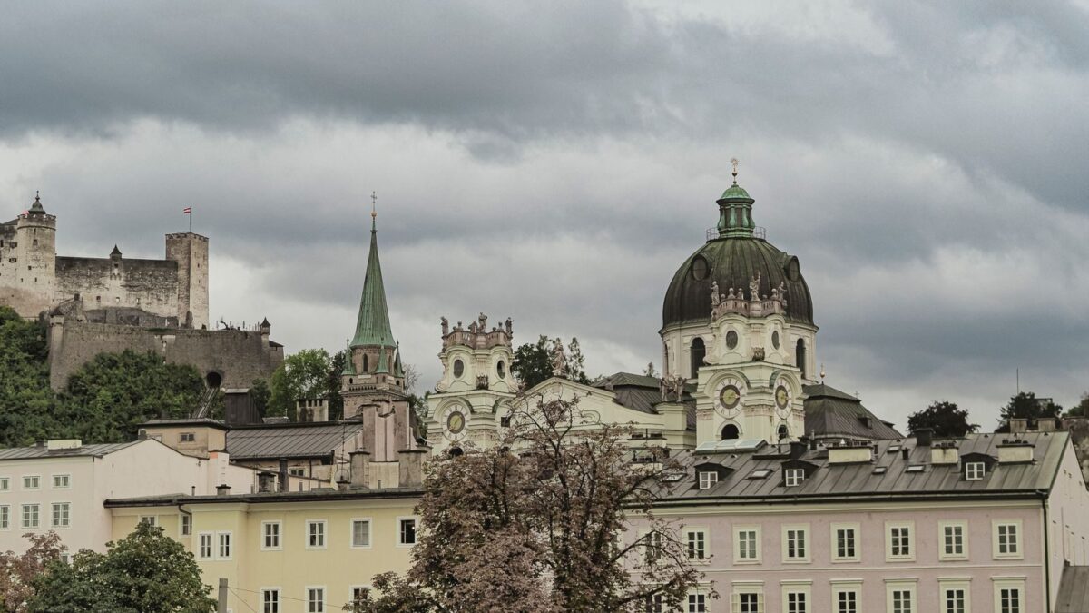 Explore the architectural charm of Salzburg's Dom Quartier with Hohensalzburg Fortress in the backdrop.