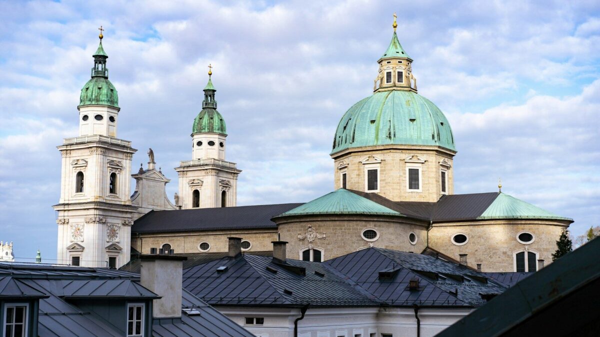 green and white dome building under white clouds during daytime