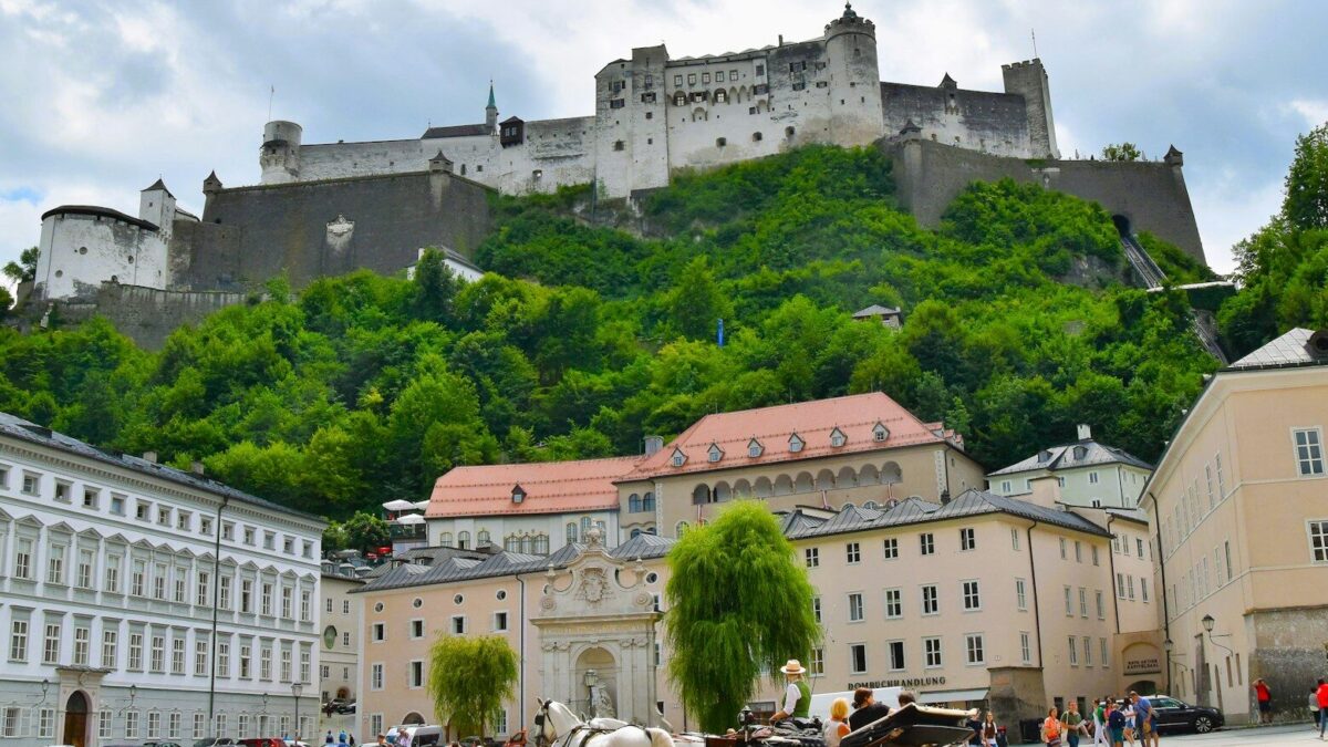 Photo by Waldemar Brandt a large building with a castle on top of it